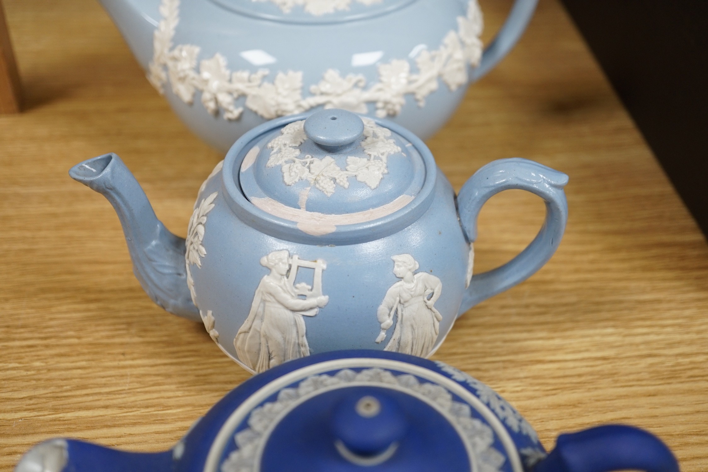 A group of Wedgwood and Wedgwood-style jasperware teapots and jugs.